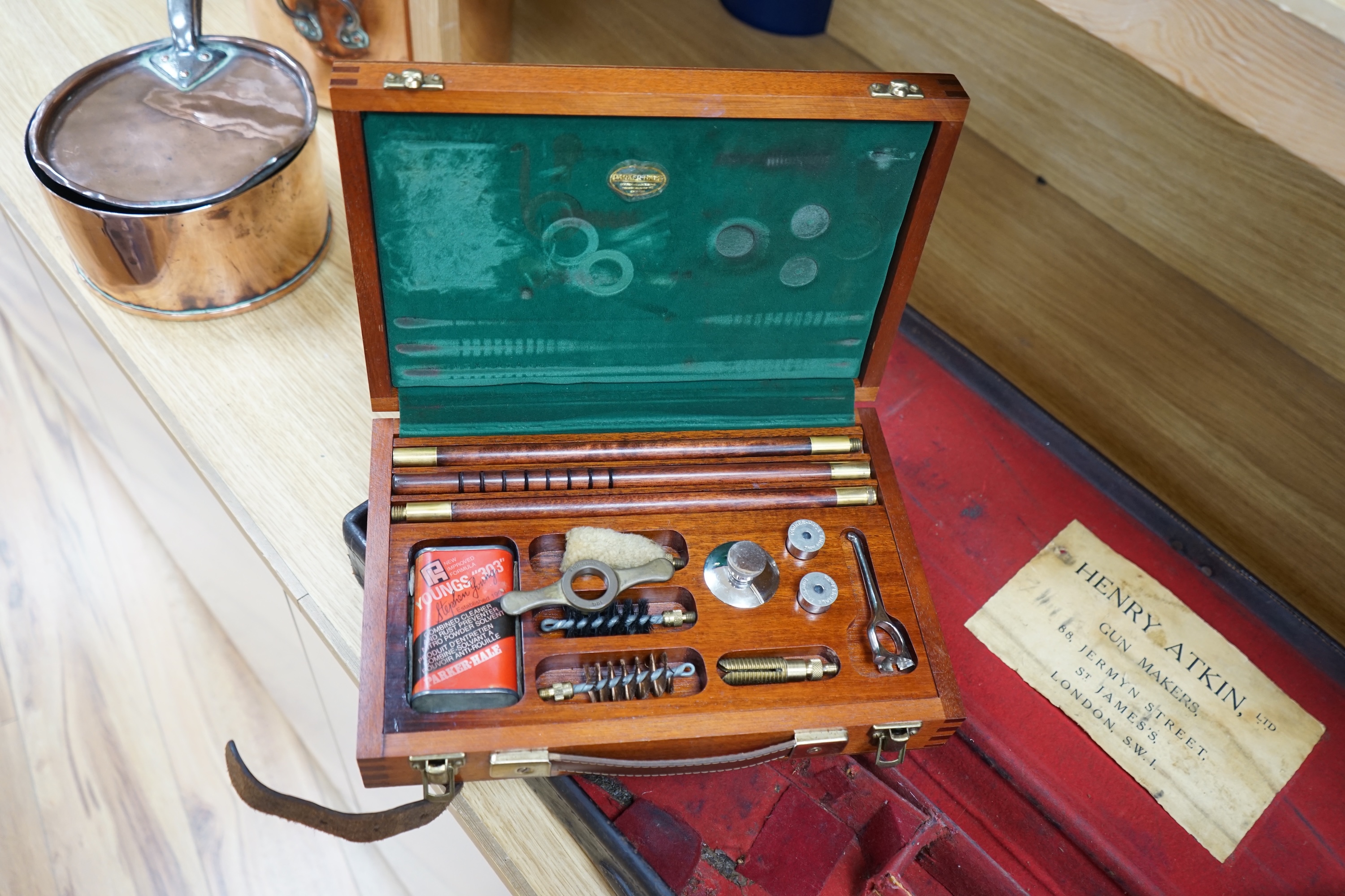 Two cases of gun cleaning equipment and a 19th century leather gun case, 83cm long. Condition - fair to good